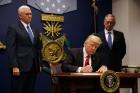 U.S. President Donald Trump signs a revised executive order for a U.S. travel ban on March 6 at the Pentagon in Arlington, Va. (CNS photo/Carlos Barria, Reuters)