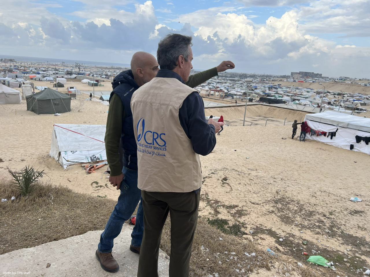 Sean Callahan, CRS chief executive, surveys IDP camp in Rafah, Gaza Strip.