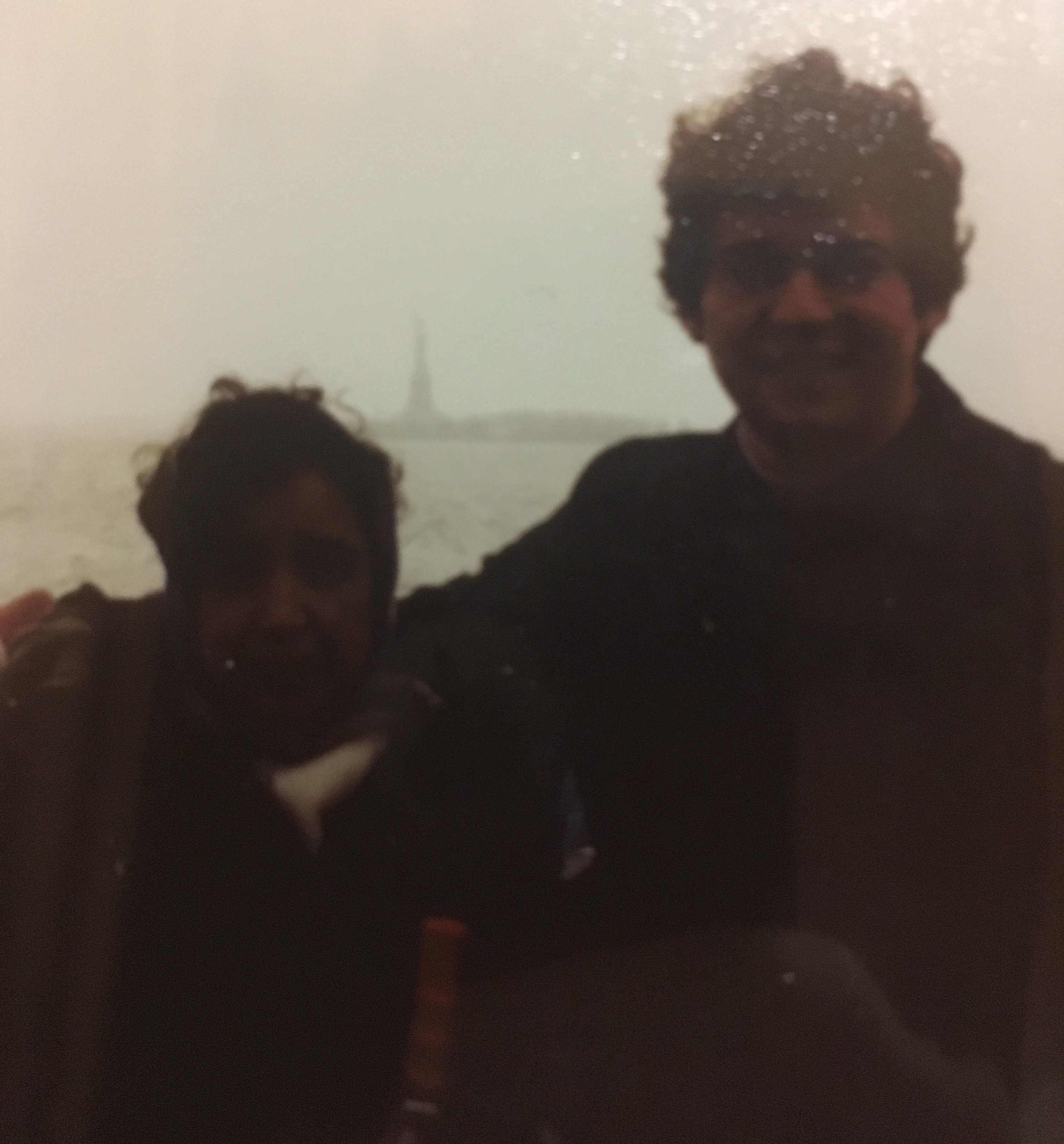 My grandmother and father at the Statue of Liberty in the early 1990s. My dad did not come to the United States by way of the New York Harbor. Nevertheless, to me, this picture still represents that he made it and that through his immigration story my own (still unborn) life as an American began.