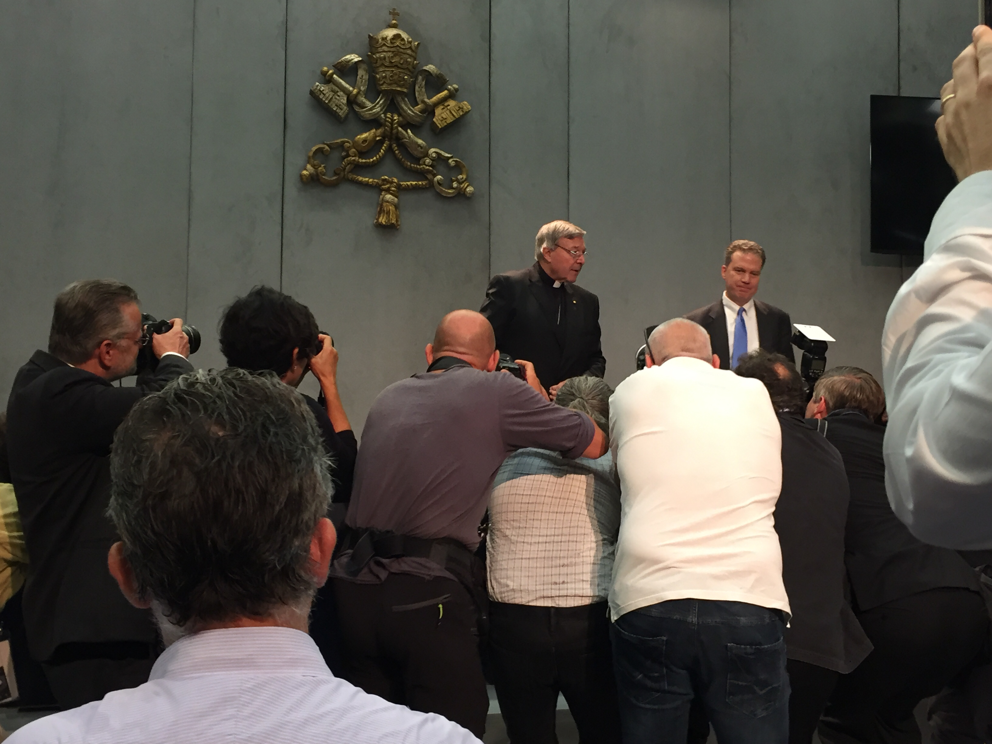 Cardinal Pell and Greg Burke speaking to the press (photo by author)