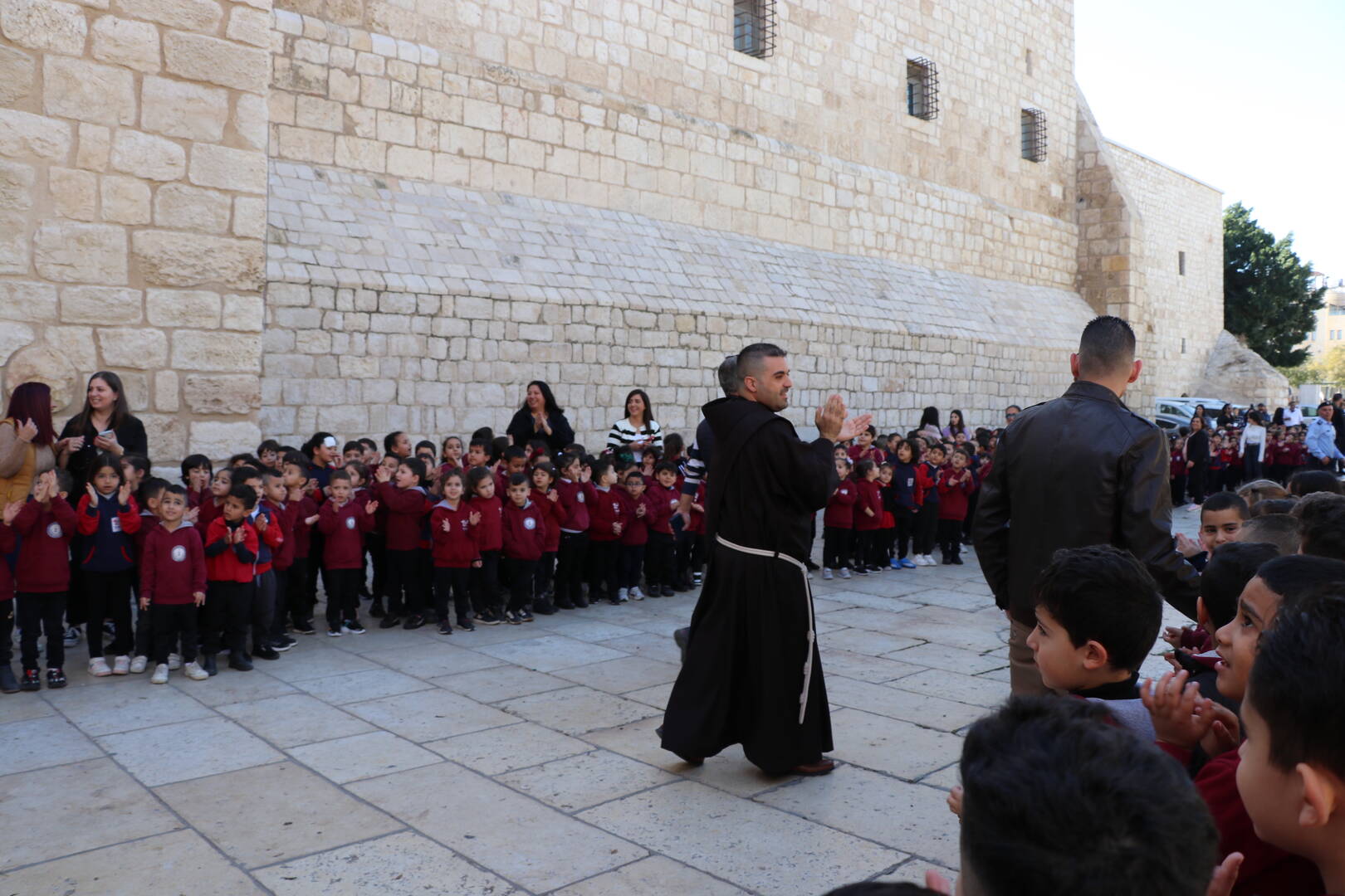 Children wait for the annual Procession of the Custos of the Holy Land, as well as Franciscan friars, into the Church of the Nativity to mark the beginning of Advent (Photo by author)