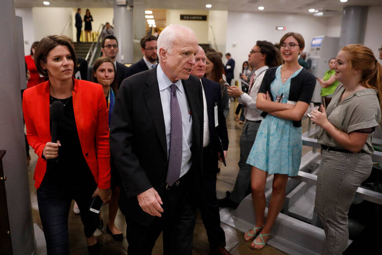 Sen. John McCain, R-Ariz., speaks with reporters ahead of a health care vote on July 27 on Capitol Hill in Washington. The Senate rejected legislation to repeal parts of the Affordable Care Act, with McCain casting a decisive "no." (CNS photo/Aaron P. Bernstein, Reuters)