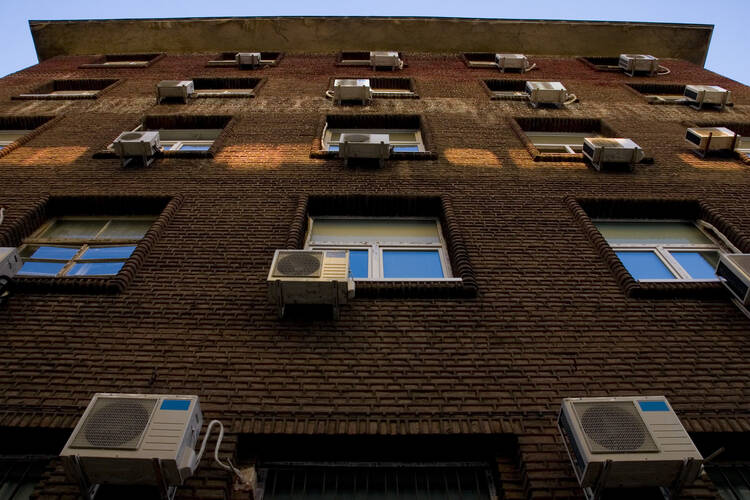 The rapid proliferation of air-conditioners to cope with the heat is itself a major contributor to global warming.(imaslev/iStock)
